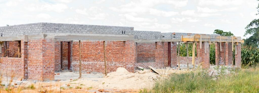Unfinished brick house at an early stage of construction